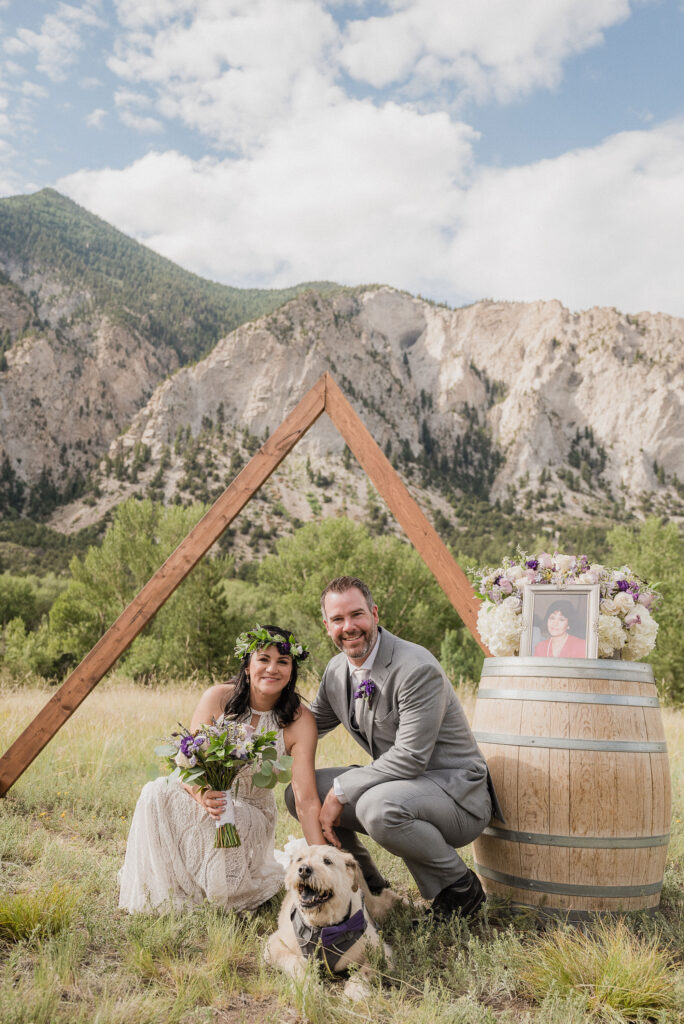 bride and groom posing for their wedding photos in colorado