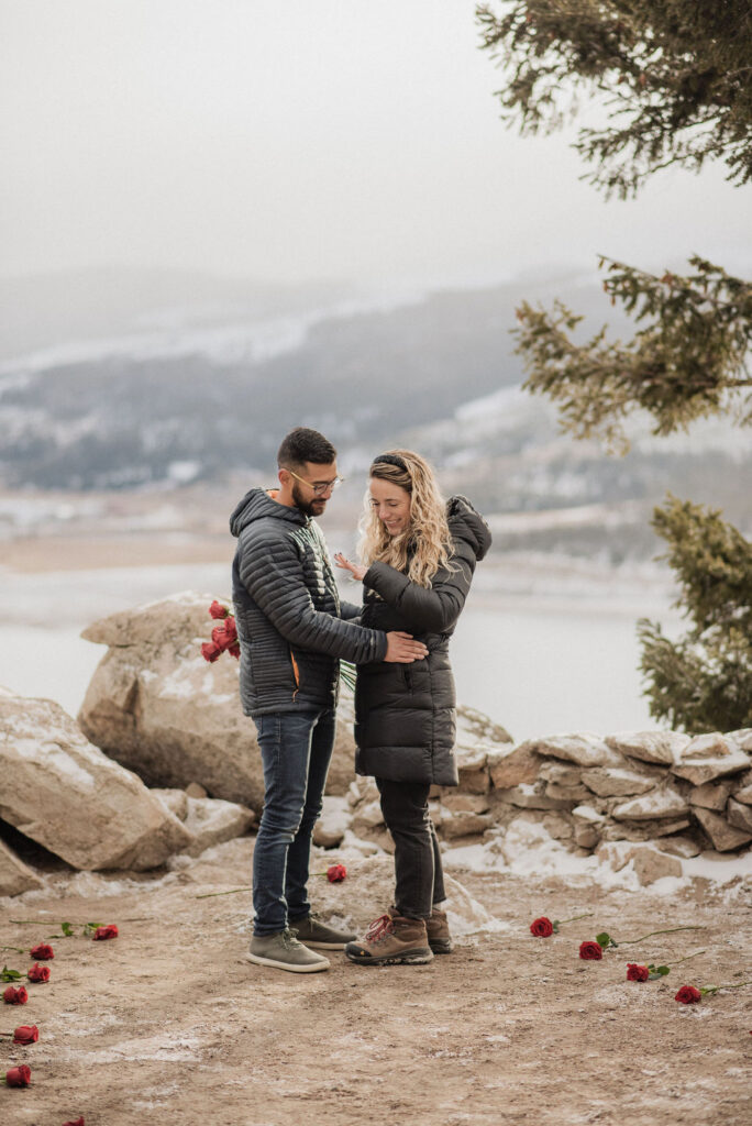 couple posing in the mountains for their engagement photos