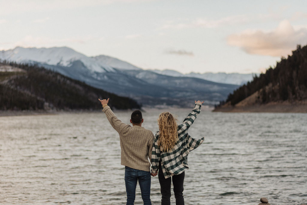couple posing in the mountains for their engagement photos