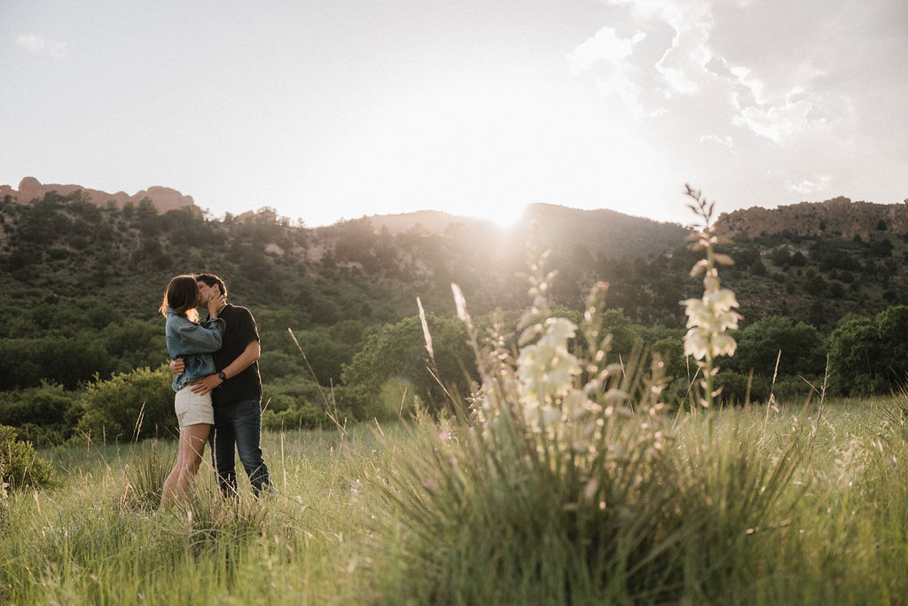 couple posing in colorado mountains for their engagement photos